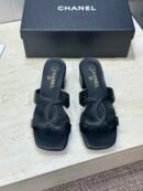 Chanel Mules in black lambskin.